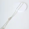 Collana lunga con nodo e perline