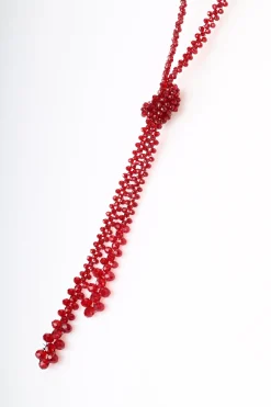 Collana lunga con perline e nodo