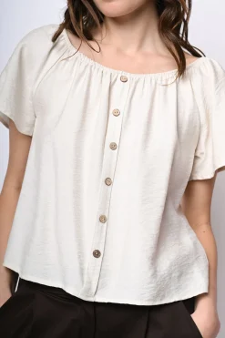 Top a spalle scoperte con bottoni