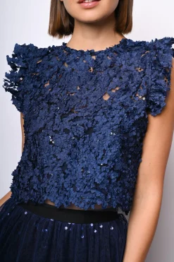 Top crop in pizzo floreale con paillettes