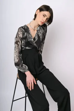 Tuta bi-materiale con stampa paisley